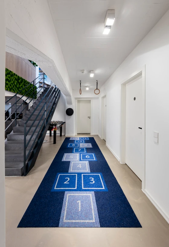 A staircase joins the ground-floor and basement, and should you find yourself in need of more exercise, directly across are further opportunities for sport. Photo: Bernadette Grimmenstein