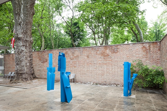 The Swiss Pavilion becomes the stage for curator Philipp Kaiser’s exploration of national identity through the lens of artist Alberto Giacometti’s concerns. Carol Bove’s abstract sculptures reference his semi-figurative sculptures