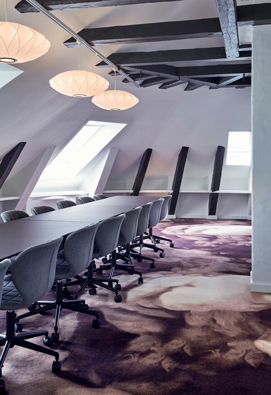 As we reach the fourth floor, white walls are finally allowed in to make room for vibrant ege carpets designed by Tom Dixon.