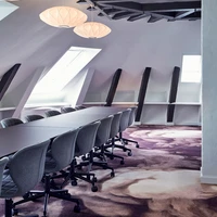 As we reach the fourth floor, white walls are finally allowed in to make room for vibrant ege carpets designed by Tom Dixon.