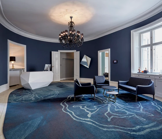 The oval shaped reception provides a luxurious hint of what to expect when exploring the rest of this beautiful house. The carpet shows an abstract flower from a preserved wallpaper in the Gold Salon dating back to 1830.