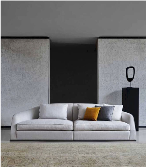 Top: Lazzeroni’s Ermione sofa has a light look with its open backrest and silvery upholstery. Above: his versatile Alfred sofa also comes with a corner element or morphs into a chaise longue