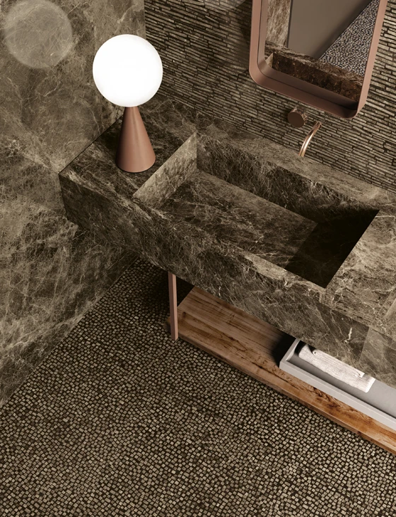 Top: Karman (Provenza) is available in finishes that mimic restored wood, smooth ceramics and concrete. Above: The Tele di Marmo collection is created by laying small dots and strips of marble into mortar