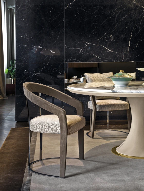 Pieces such as the David table and Frances chairs demonstrate how Longhi’s furniture combines luxurious materials including Canaletto walnut, solid ash, marble, leather and chromed metal