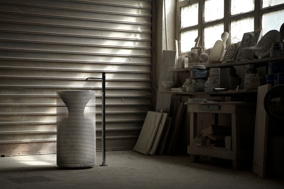 The sculptor’s marble-carving skills (top) inspired the Introverso sink, hewn from marble using CNC technology