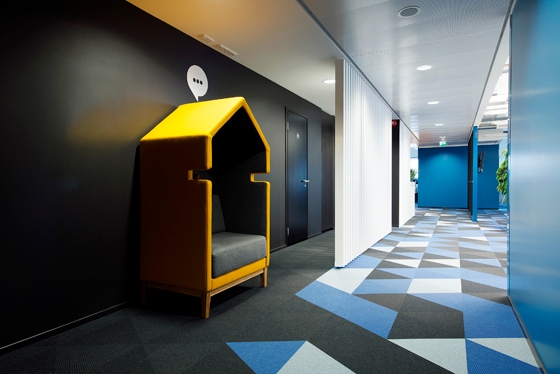 At the newly renovated headquarters of software company Playtech, the carpet design mirrors the company's logo and connects different working areas. ©Terje Ugandi